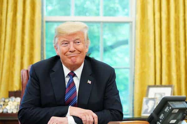 Trump ponders at desk