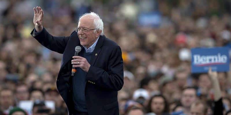 bernie sanders smiling waving