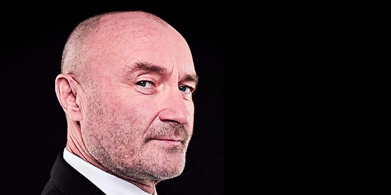 Phil Collins in profile looking smugly at the camera