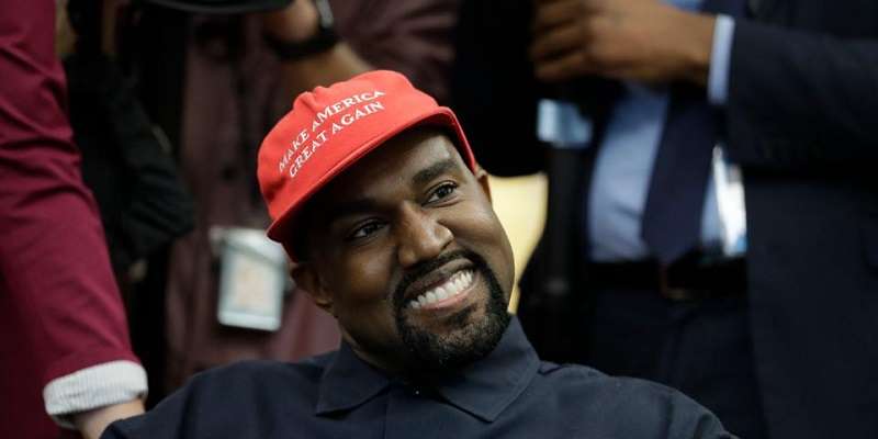 Kanye West wearing a Make America Great Again hat