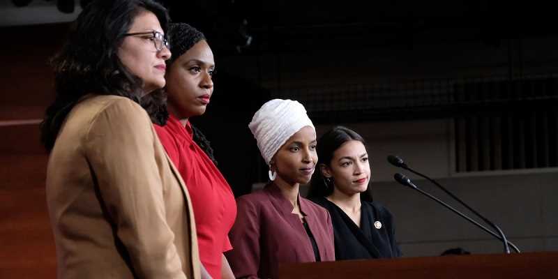 The Squad from the US House at a podium